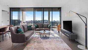 Three Bedroom Two Bathroom Apartment | Living area | 50-inch LCD TV with digital channels, TV