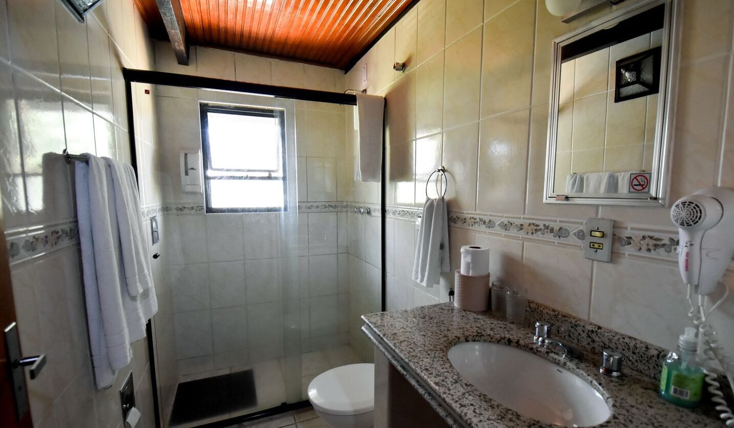 standard triple room | bathroom | shower, rainfall showerhead, hair dryer, towels