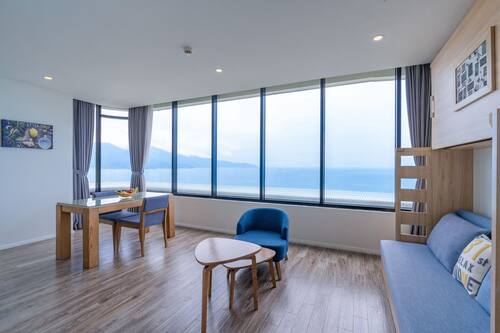 Deluxe Apartment, Kitchen, Sea View | Minibar, in-room safe, desk, blackout curtains