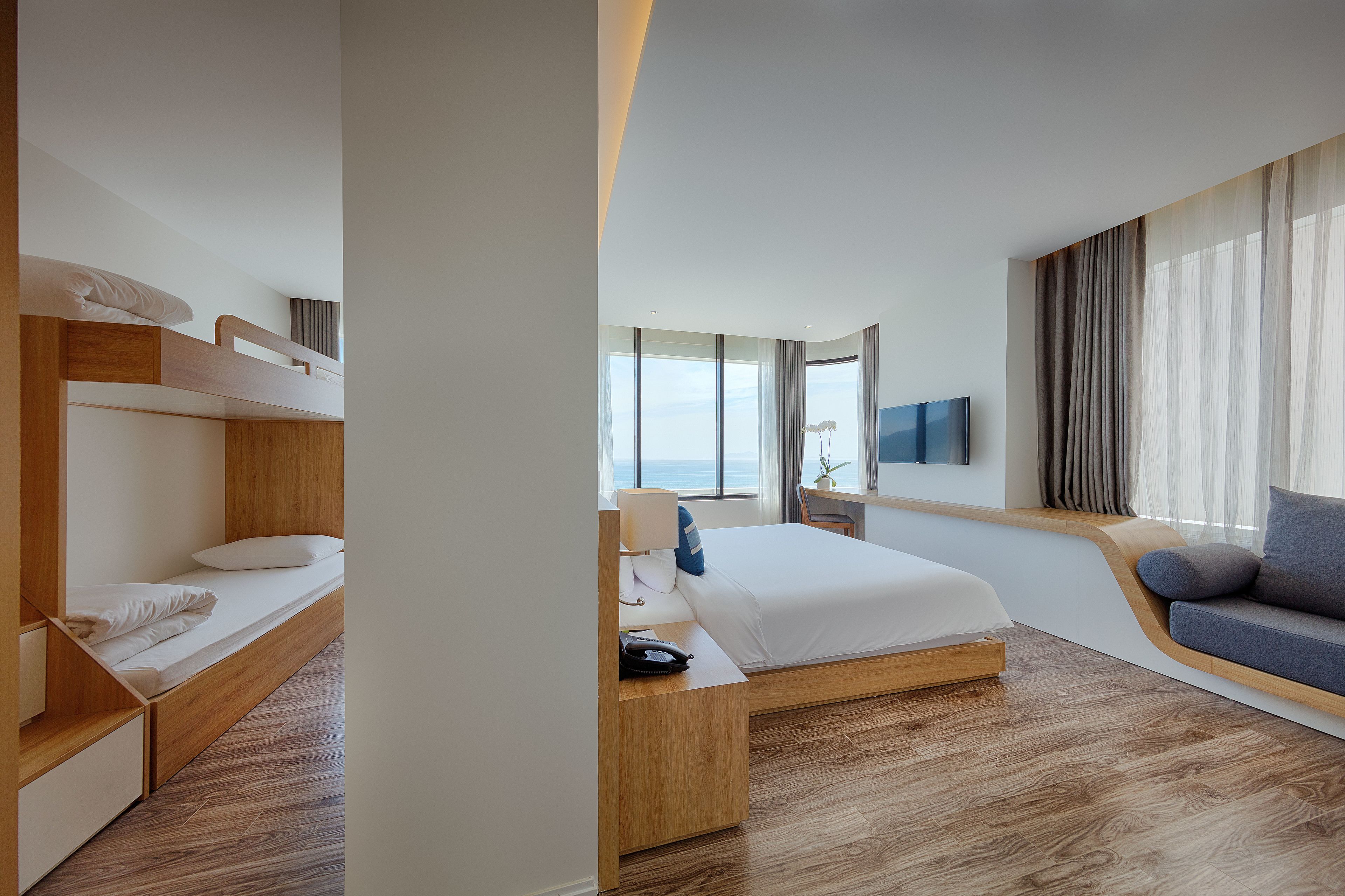 family suite, ocean view | minibar, in-room safe, desk, blackout curtains