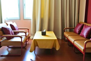 Family Triple Room, 1 Bedroom | Living area | Flat-screen TV