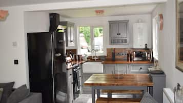 Microwave, coffee/tea maker, cookware/dishes/utensils