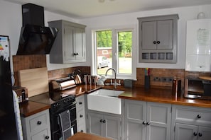 Microwave, coffee/tea maker, cookware/dishes/utensils