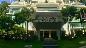 A high-rise building with multiple balconies and a prominent entrance. - AirPorter Bukit Bintang Residence (Kuala Lumpur)
