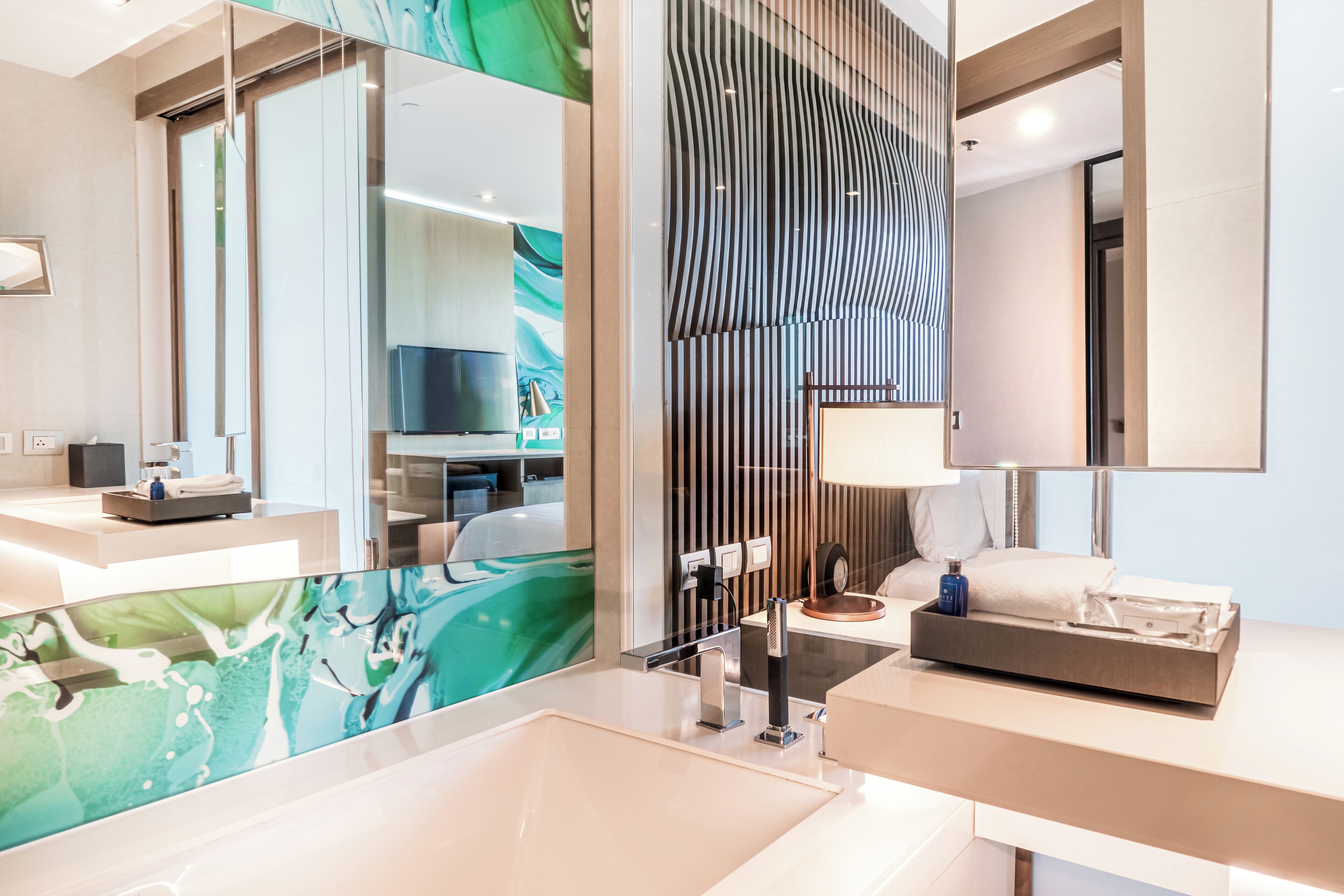 designer toiletries, hair dryer, bathrobes, slippers