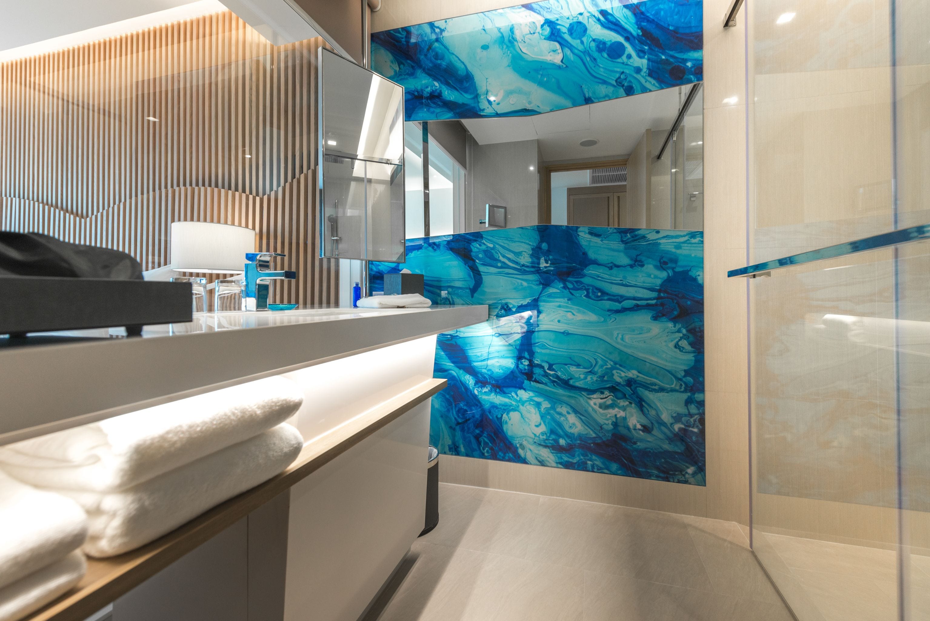 designer toiletries, hair dryer, bathrobes, slippers