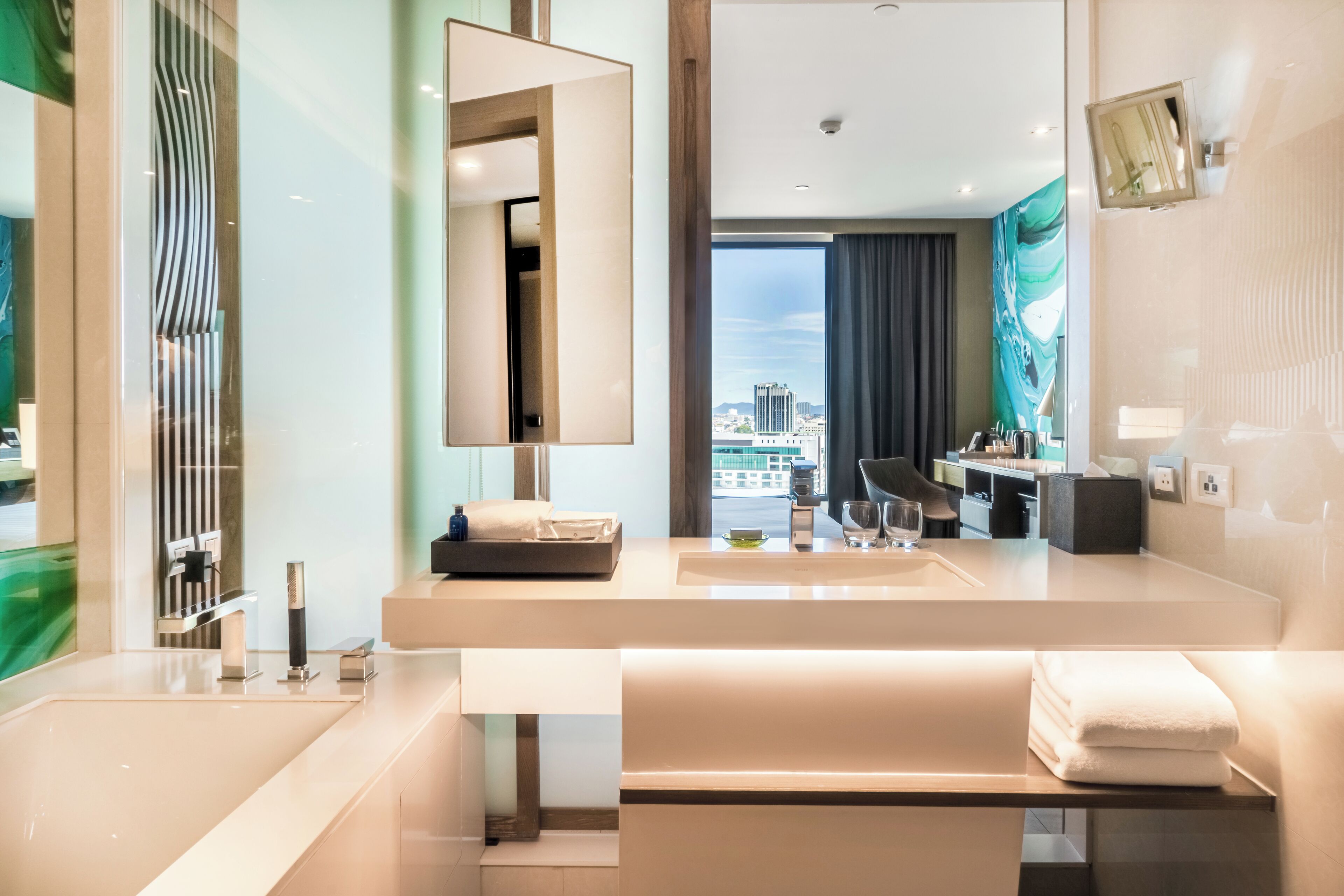 designer toiletries, hair dryer, bathrobes, slippers