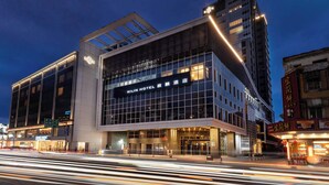 A modern hotel building with a prominent sign reading "KILIN HOTEL." - Kilin Hotel, JiaoXi (Jiaoxi)