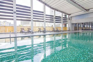 Indoor pool, open 2:00 PM to 10:00 PM, sun loungers