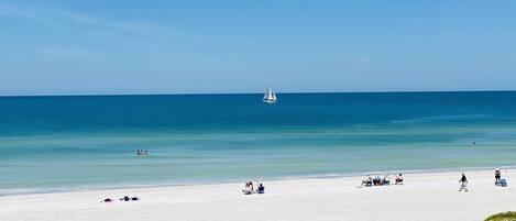 On the beach, sun loungers, beach towels