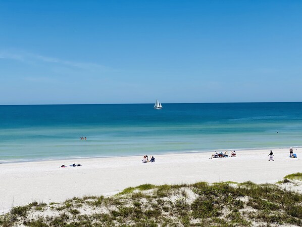 On the beach, sun loungers, beach towels