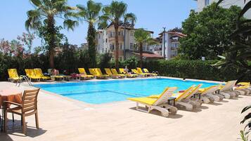 Outdoor pool, pool umbrellas, pool loungers