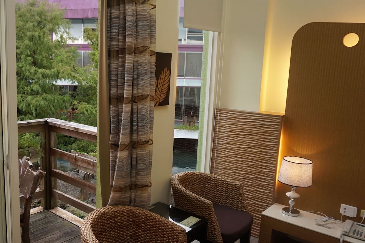 family quadruple room, lakeside | living area | lcd tv