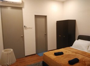 A bedroom with a bed, a wardrobe, a door, and a lamp. - Cozy Crib at 7 Tree Seven Residence (Cheras)