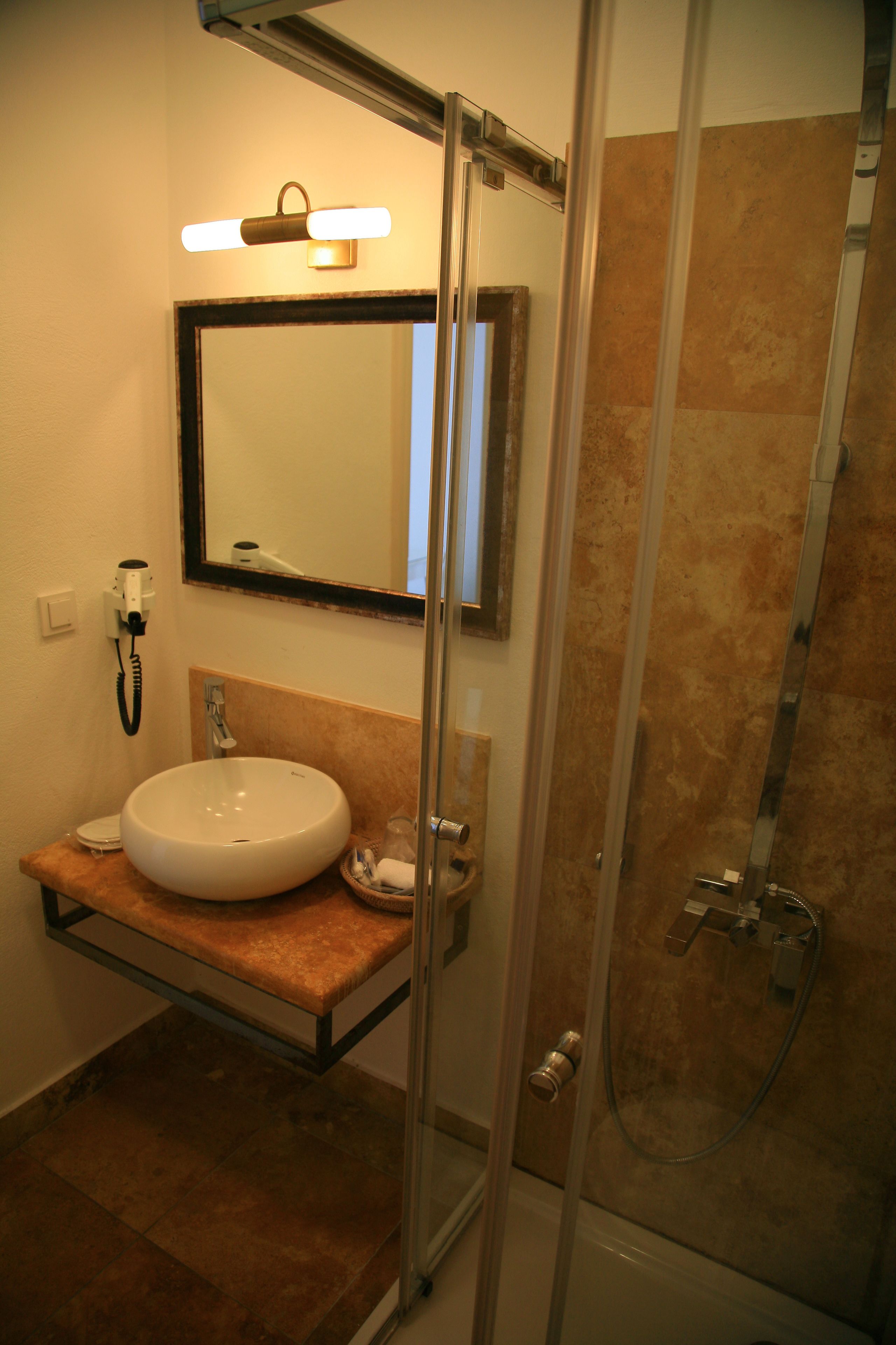 standard room | bathroom | shower, free toiletries, hair dryer, slippers