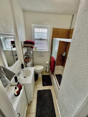 Bathtub, hair dryer, towels, soap