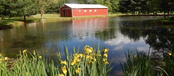 Restored Historical Farmhouse With Pond And Farm Animals At Mohican State Park