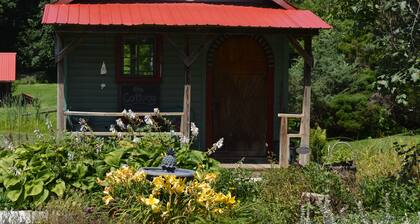 Restored Historical Farmhouse With Pond And Farm Animals At Mohican State Park