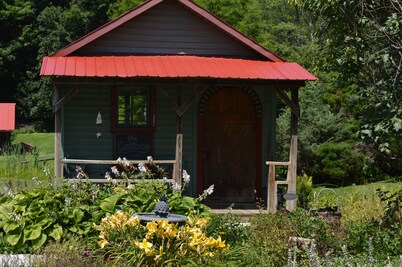Restored Historical Farmhouse With Pond And Farm Animals At Mohican State Park