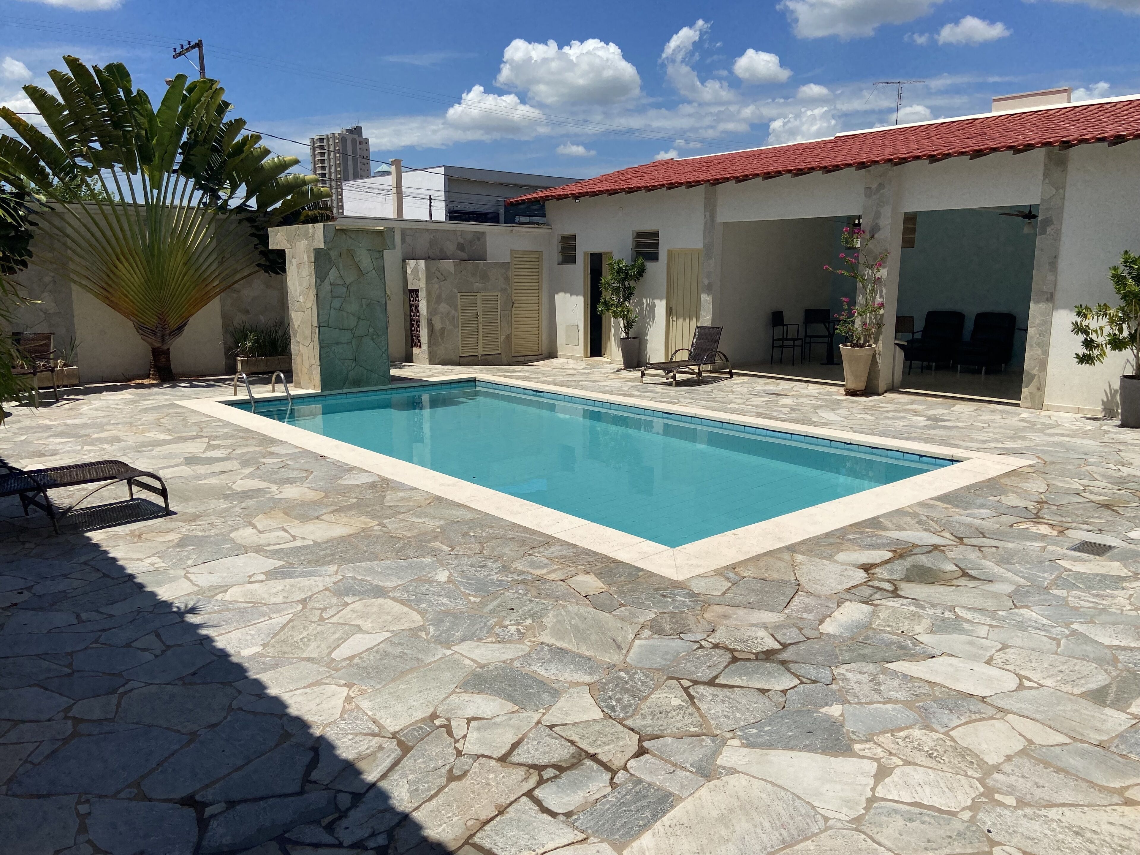 Outdoor pool, open 8:00 AM to 10:00 PM, pool loungers