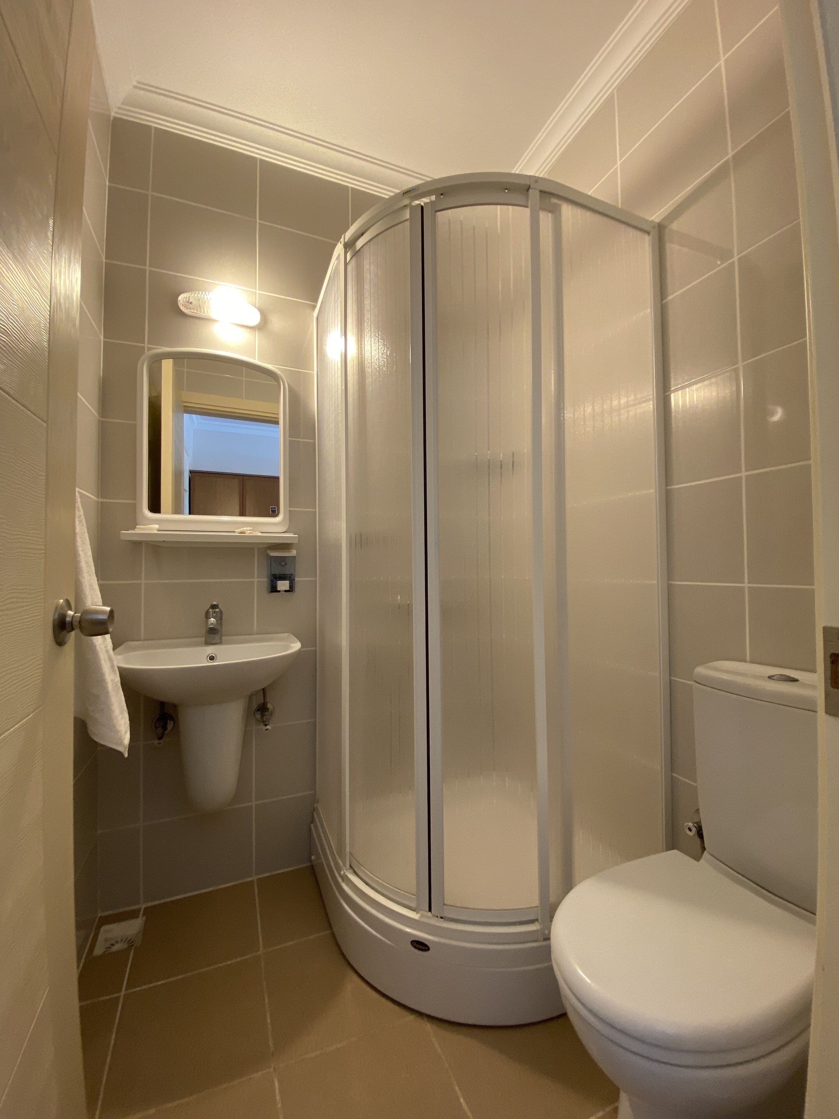 economy triple room | bathroom | shower, free toiletries, hair dryer, slippers