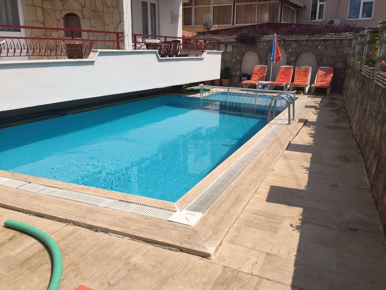 Outdoor pool, pool umbrellas, pool loungers