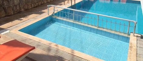 Outdoor pool, pool umbrellas, pool loungers