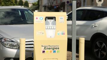 A parking meter with a sign indicating no parking.