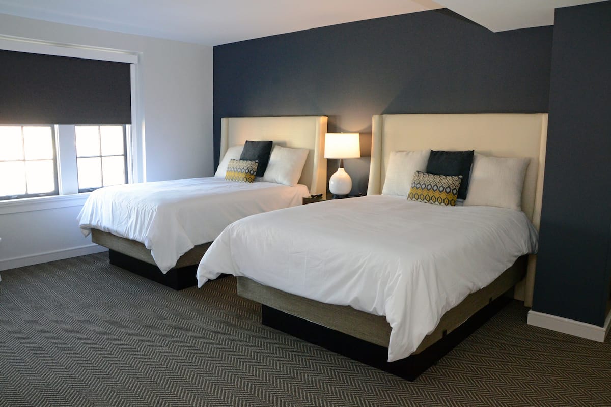 deluxe suite | premium bedding, desk, laptop workspace, iron/ironing board