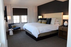 Premium bedding, desk, laptop workspace, iron/ironing board