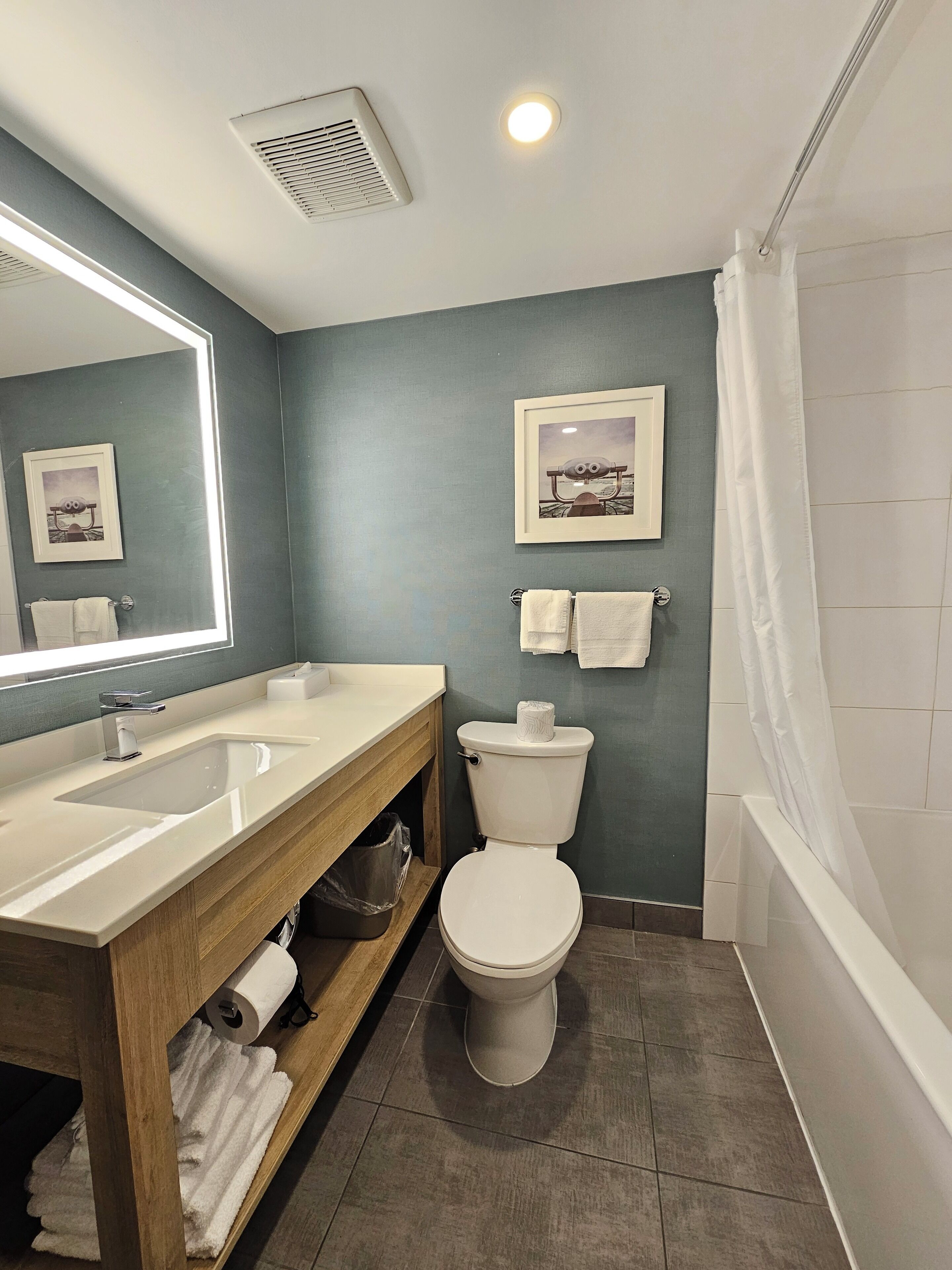 studio guest room, 2 queen beds & sofa bed | bathroom | free toiletries, hair dryer, towels, soap