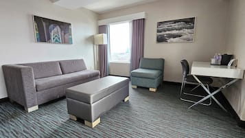 Deluxe Room, 2 Queen Beds (Deluxe Family Suite) | Living area | 49-inch flat-screen TV with satellite channels, TV