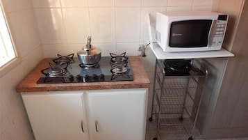 Standard Apartment, 3 Bedrooms | Private kitchen | Full-size fridge, microwave, stovetop, cookware/dishes/utensils