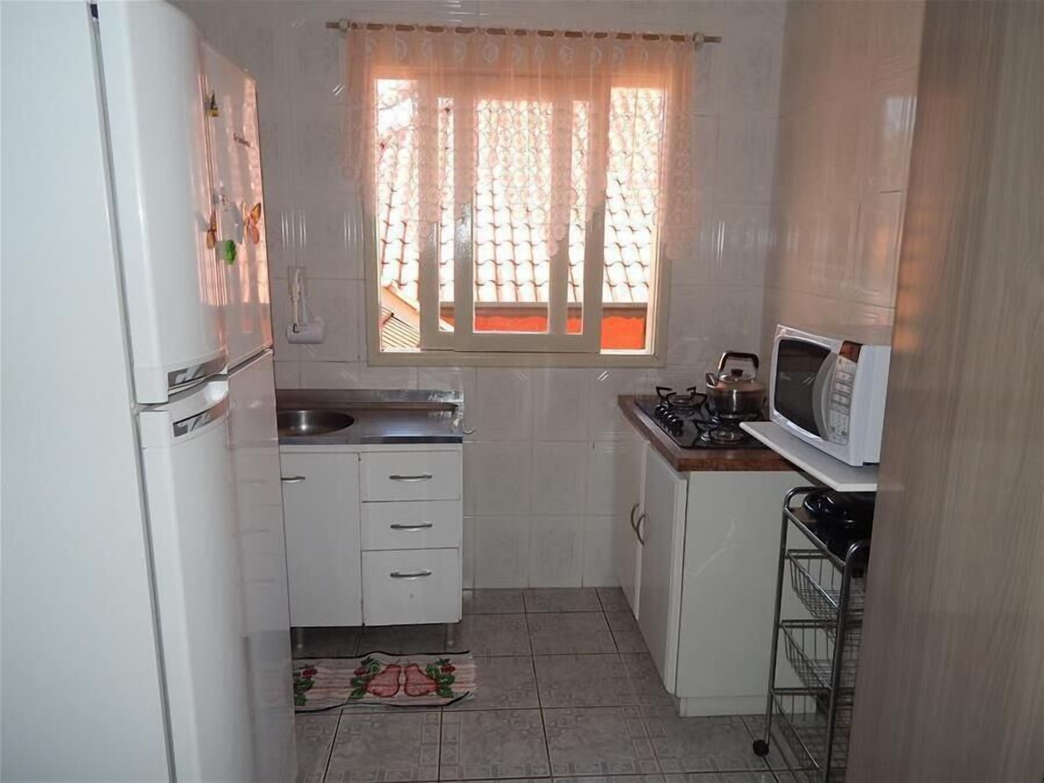 Standard Apartment, 3 Bedrooms | Private kitchen | Full-sized fridge, microwave, stovetop, cookware/dishes/utensils