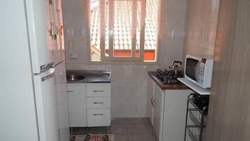 Standard Apartment, 3 Bedrooms | Private kitchen | Full-sized fridge, microwave, stovetop, cookware/dishes/utensils