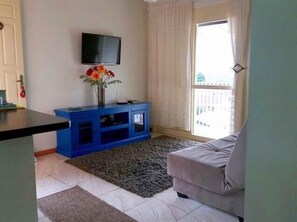 Traditional Apartment, 2 Bedrooms | Living room | LED TV, fireplace