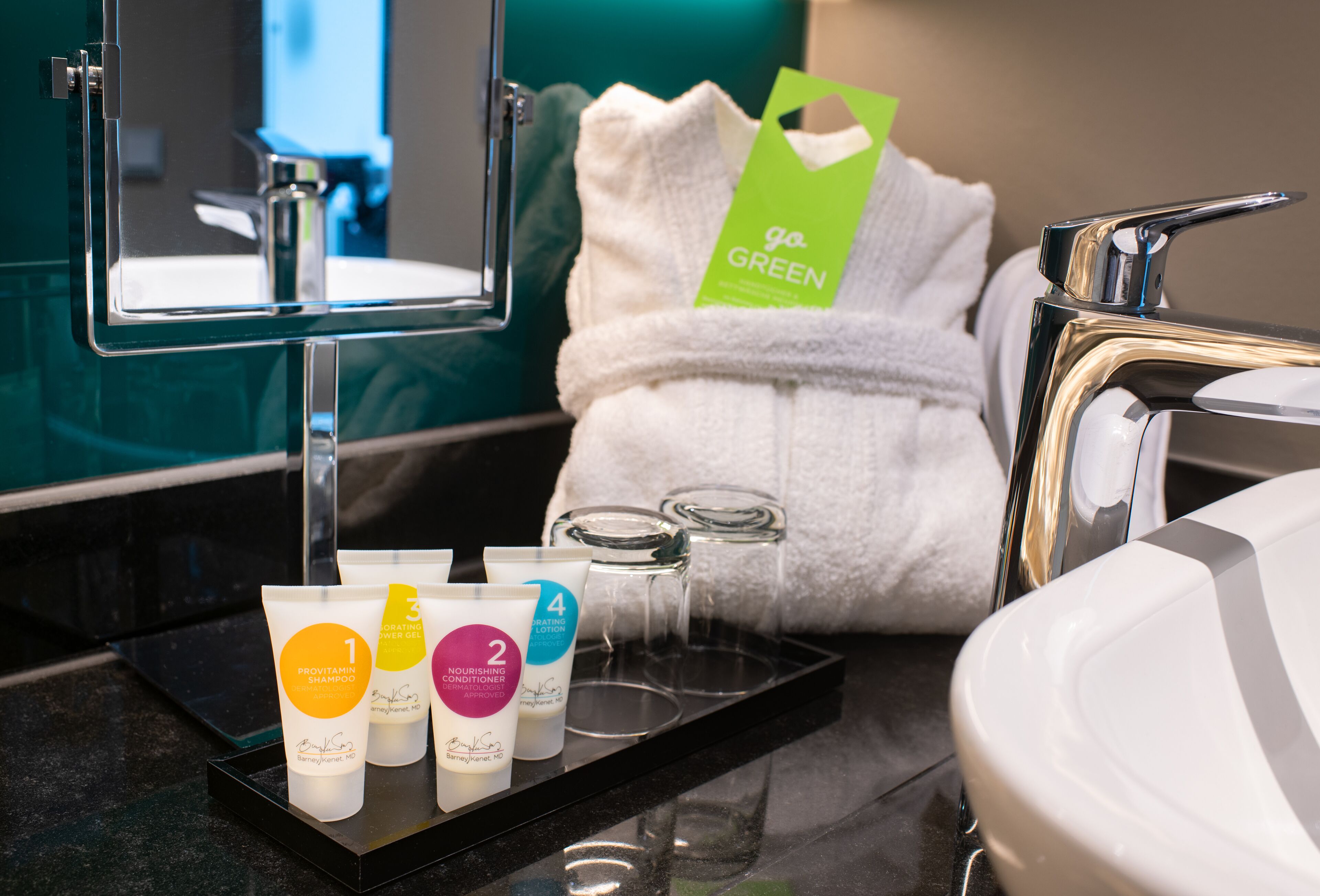 designer toiletries, hair dryer, towels