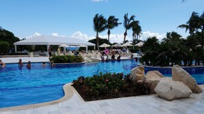 3 outdoor pools, open 8:00 AM to 10:00 PM, pool umbrellas, pool loungers