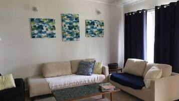 Cottage, 4 Bedrooms | Living area | LCD TV, fireplace, DVD player