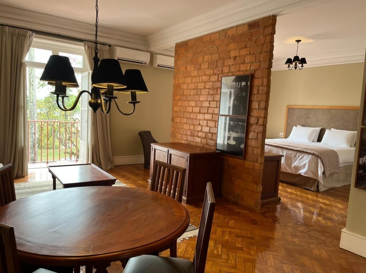 superior studio suite, 1 bedroom, garden view | minibar, in-room safe, laptop workspace, blackout curtains