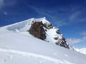 A snow-covered mountain peak with rocky outcrops. - Savoyard chalet overlooking Lac LÉMAN (Armoy)