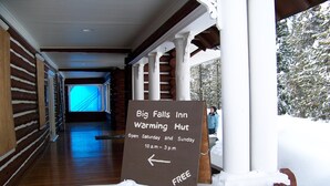 A sign for Big Falls Inn's warming hut, indicating it's open on Saturdays and Sundays from 10 a.m. to 3 p.m. - Gateway To Yellowstone Park And Outdoor Adventure. FREE internet and cleaning. (Island Park)