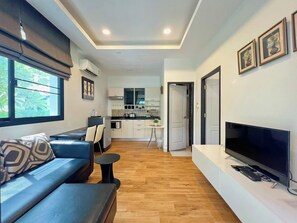 Honeymoon Villa | Living area | 42-inch flat-screen TV with cable channels, TV