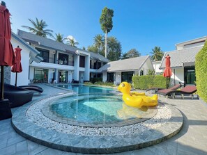 Outdoor pool, open 7 AM to 7:00 PM, pool umbrellas, pool loungers