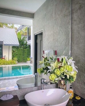 Outdoor pool, open 7 AM to 7:00 PM, pool umbrellas, pool loungers