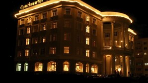 A hotel with a classic architectural style, featuring arched windows and a prominent entrance with columns. - The Continental Hotel (Ulaanbaatar)