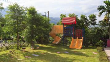 A playground with slides and climbing structures.