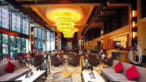 A spacious lobby with multiple seating areas, a central chandelier, and large windows allowing natural light. - Felton Grand Hotel Chengdu (Chengdu)