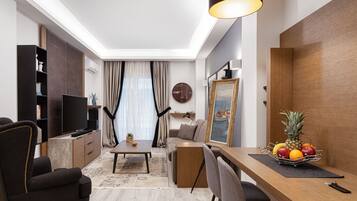 Elite Apartment, 1 Queen Bed with Sofa bed, Balcony | Living area | 50-inch flat-screen TV with cable channels, Smart TV, Netflix