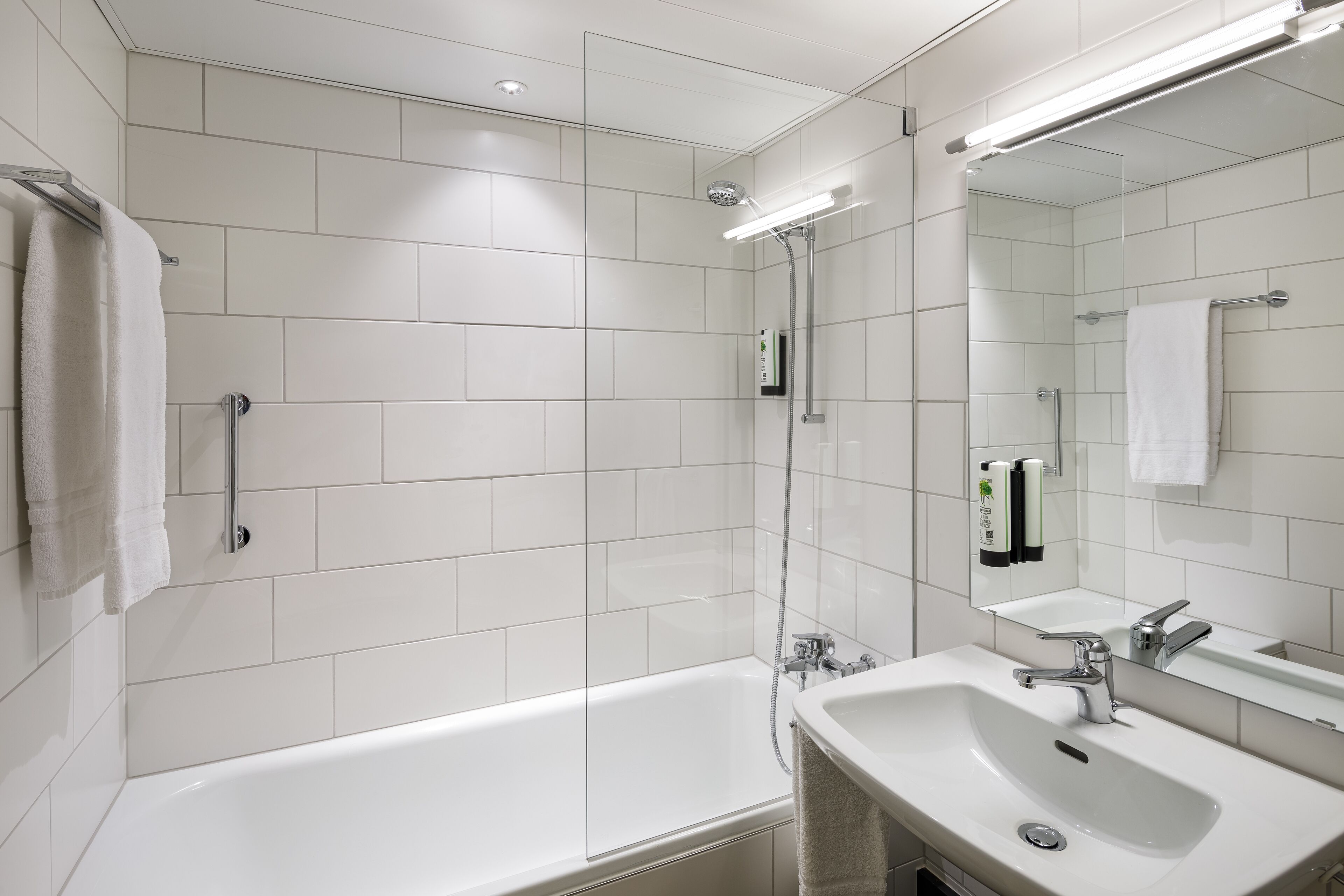 bathtub, free toiletries, hair dryer, towels